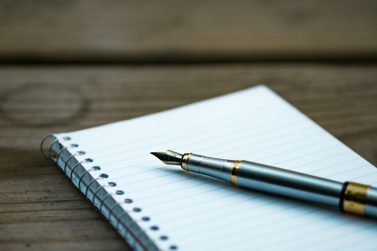 Open wellness journal with pen