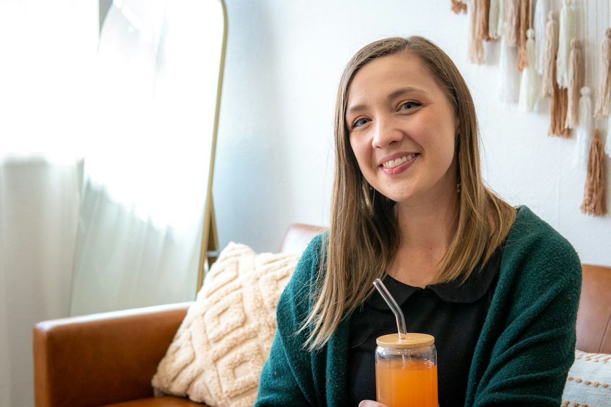 Woman enjoying a wellness drink